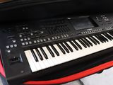 a keyboard in a case that is open on the ground