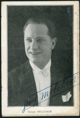 a black and white photo of a man in a suit and tie