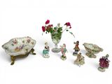 many figurines that are sitting on a table