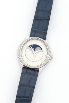 an image of a close up of a wrist watch on a white surface
