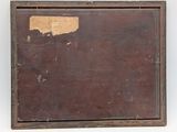 an old wooden picture frame with a piece of brown paint on it