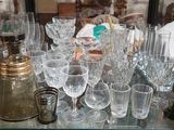 a glass table with a lot of wine glasses on it