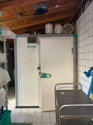 an image of a kitchen with a sink and a refrigerator