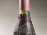 a bottle of wine that is sitting on a table