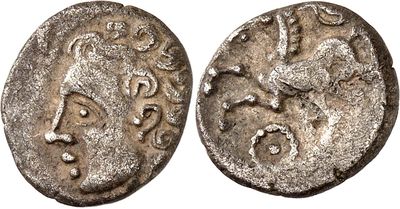 a silver coin with an image of a man on it