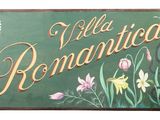 a sign that says villa romantica with flowers on it