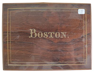 an old wooden box with the word boston written on it