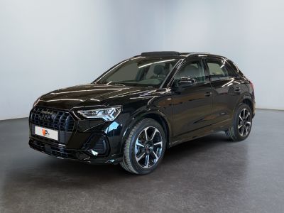 a black audi qx parked in a large room
