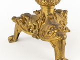 an antique brass candle holder on a white background with a white background