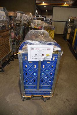 a blue cart with a sign on it in a warehouse