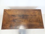 an image of a wooden tray with a handle on a table