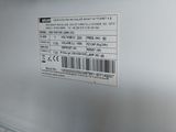 a close up of a refrigerator door with a label on it