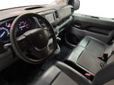 a dashboard of a truck with a clock on the dash