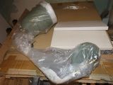 a pair of shoes that are wrapped in plastic on a table