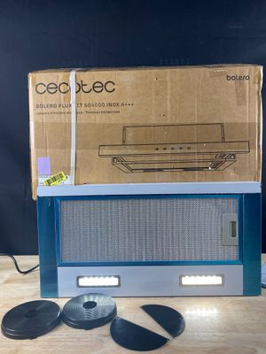 an old radio sitting on top of a wooden table next to a cardboard box