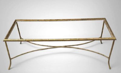 an image of a bamboo and metal coffee table with a glass top