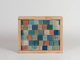 a small wooden box with a multicolored tile pattern on it