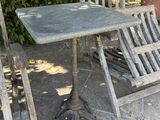 two chairs and a table on the patio