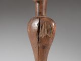 an image of a wooden sculpture of a man ' s head
