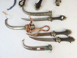 many different types of knives on the table