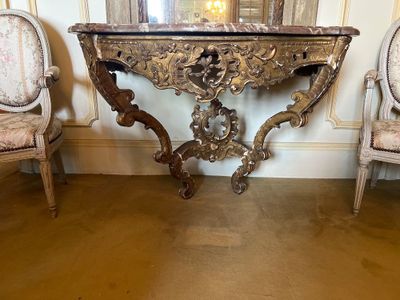 an image of a table and chairs in a room with a mirror