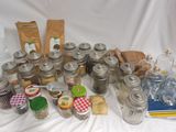many jars and jars of food on a table