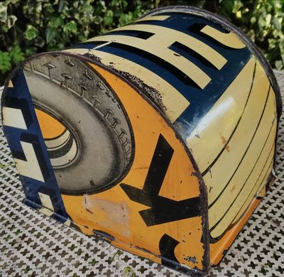 a yellow and blue box that has a tire on it
