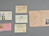 some old papers and stamps are sitting on a table