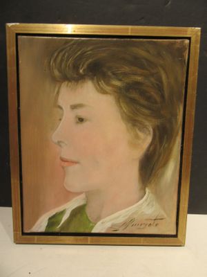 portrait of a young girl in a green dress by a gold frame