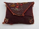 an image of a small pillow with a flower design on it