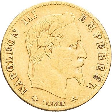 gros plan d'une pièce d'or sur laquelle figure le visage d'un homme
