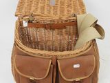 an image of a wicker picnic basket with leather handles