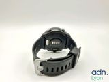 a close up of a watch on a white surface with a white background