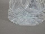 a clear glass vase with a flower inside of it