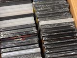 a box full of dvds and cds sitting on a table