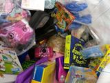 a pile of children ' s toys in a plastic bag