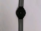 a close up of a watch sitting on top of a white surface