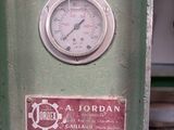 a gauge that is on the side of a green machine