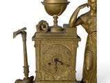 a statue of a woman holding a globe and a clock