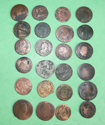 a lot of coins that are on a green surface