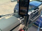 a picture of a car dashboard with a tablet on it