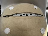a stuffed animal sitting on a chair with polka dots on it