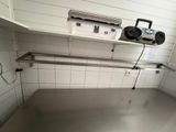 an image of a commercial kitchen with stainless steel counter tops