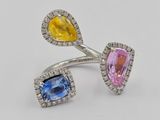 a close up of two rings with different colored stones on them