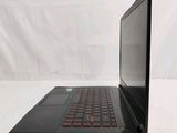 a black laptop with a red keyboard sitting on a white surface