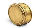 a gold coin sitting on top of a white surface