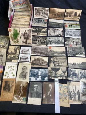 an old photo of a table full of old photographs and postcards