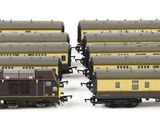 two trains that are sitting next to each other on the tracks