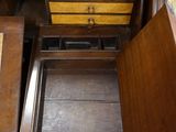a wooden desk with a drawer on top of it
