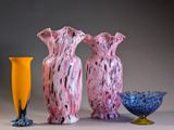 three vases sitting next to each other on a table